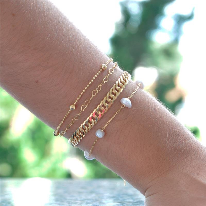 PULSEIRA COM PÉROLAS BARROCAS FOLH. OURO