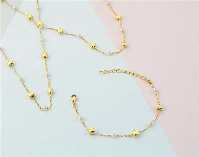 PULSEIRA PÉROLAS COM CORAÇÕES FOLHEADO OURO